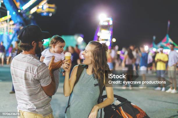 Young Millennial Family Enjoying Their Time At The Empire State Fair In Springfield Mo On A Hot July Summer Night Stock Photo - Download Image Now