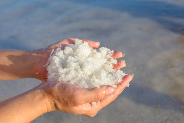 istock A handful of salt from a salt lake. Salt mine. 1170628128