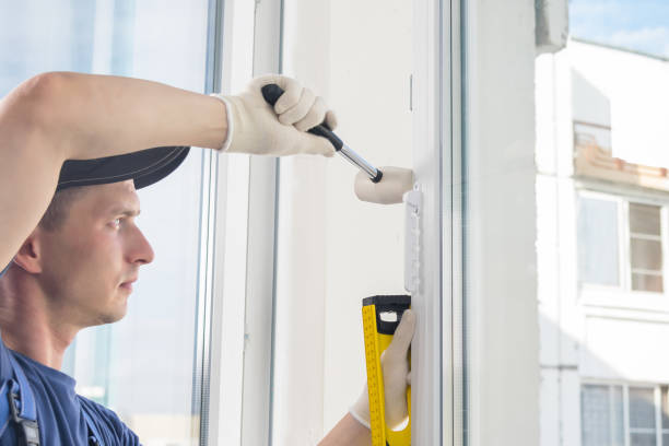 istock the master aligns the plastic window with a rubber mallet and a special level 1170628959