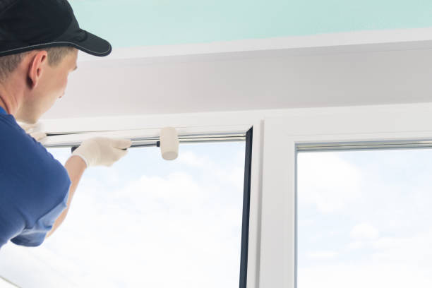 istock master clogs with a rubber mallet a fastener for a double-glazed window in a plastic window 1170628972
