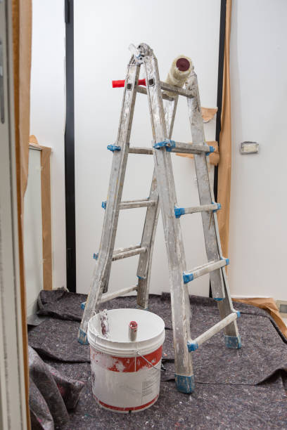 istock Staircase and Tools for Painting and Floor Covered with Protective Sheeting 1170629798