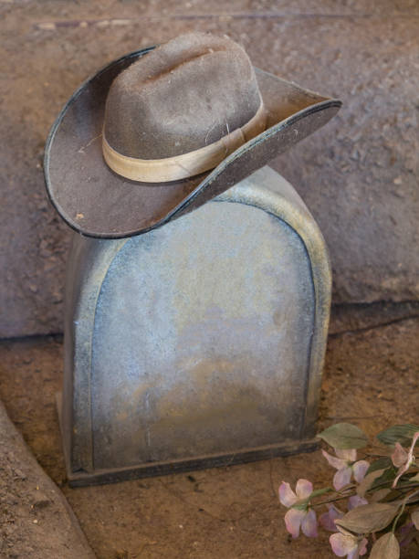 istock Cowboy Hat Over a Tombstone in a Cemetery 1170629896