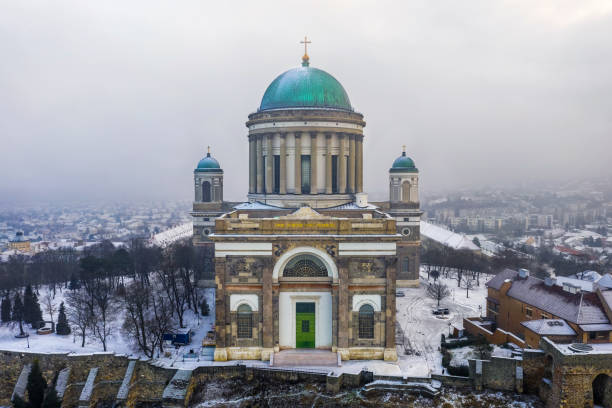 Esztergom, Hungary - Aerial view of the beautiful snowy Basilica of Esztergom on a foggy winter morning stock photo
