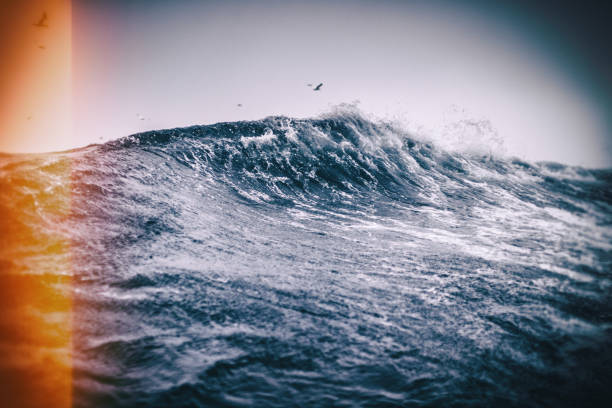 Fishing boat sailing out at rough sea