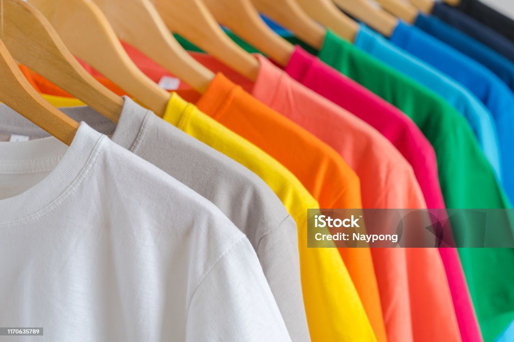 Close Up Of Colorful Tshirts On Hangers Apparel Background Stock