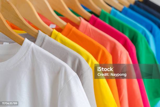 Close Up Of Colorful Tshirts On Hangers Apparel Background Stock Photo - Download Image Now