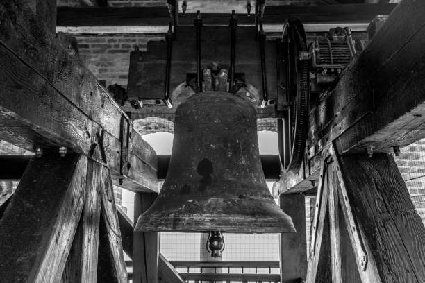 Large bell on the bell tower in the medieval tower on the island of Trocello