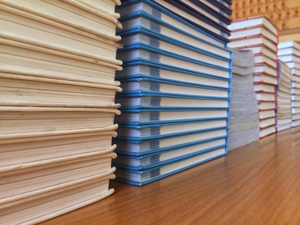 istock Smooth stacks of textbooks on the table close-up 1170637995