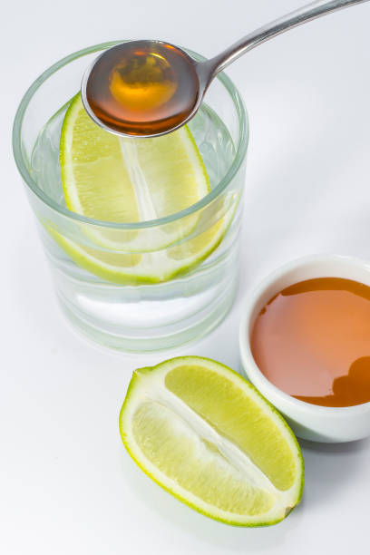 istock Glass of warm water with lemon and honey. 1170638110