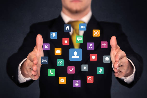 istock Businessman holding colorful applications 1170638520