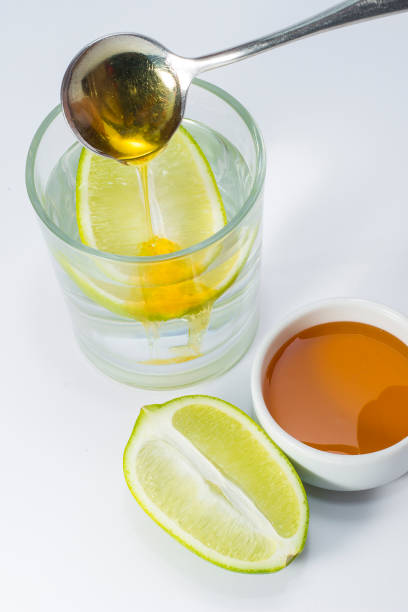 boisson chaude au miel de miel de citron. - waterlemon photos et images de collection