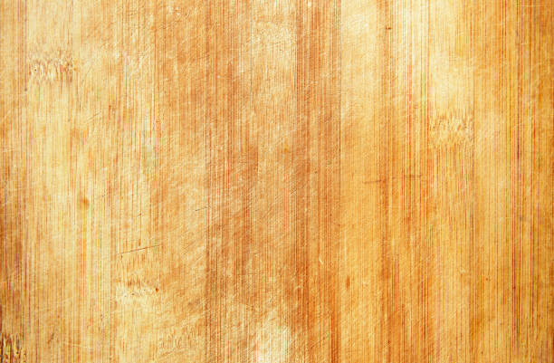 Grunge old bamboo cutting board textured background Grunge old bamboo cutting board textured background knotted wood wood dirty weathered stock pictures, royalty-free photos & images