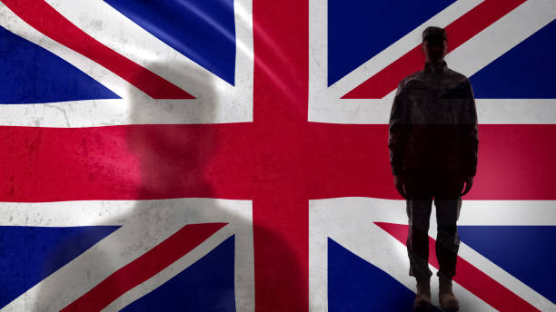 istock British soldier silhouette standing against national flag, proud army sergeant 1170641473