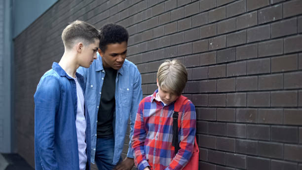 istock Cruel high school students bullying junior boy, verbal abuse, intimidation 1170641585