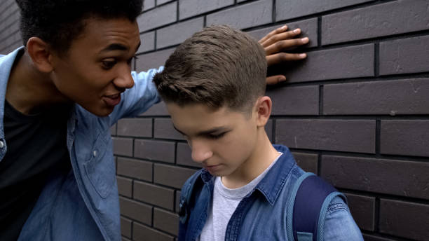 istock Mean african american student mocking weak boy, psychological abuse, threat 1170641837