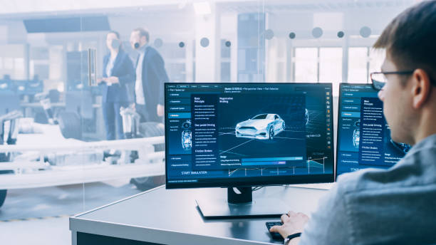 istock Professional Engineer Works on a Computer with a 3D CAD Software and Tests the Electric Car Chassis Prototype with Wheels, Batteries and Engine Standing in a High Tech Development Laboratory. 1170643167