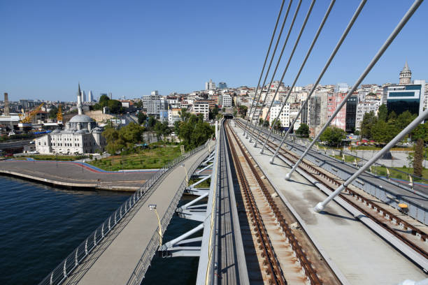 golden horn metro bridge - wiedenmeier istanbul stock-fotos und bilder