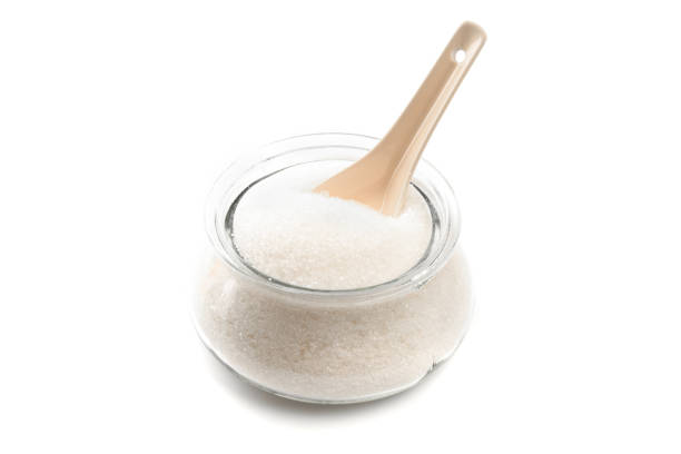 istock Sugar in  glass bowl on white background  top view- Image 1170647091
