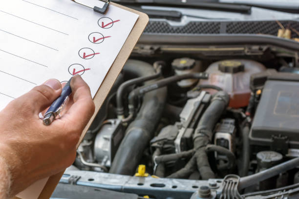 Checking the technical condition of a car with the help of a checked checklist car check hook equipment photos stock pictures, royalty-free photos & images