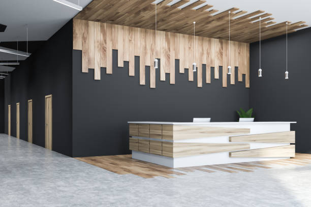 istock Gray and wooden office hall corner, reception desk 1170651615
