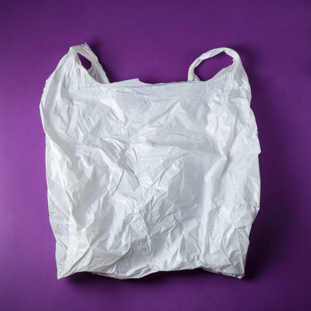 istock White Disposable Plastic Bag On Purple Background 1170656243