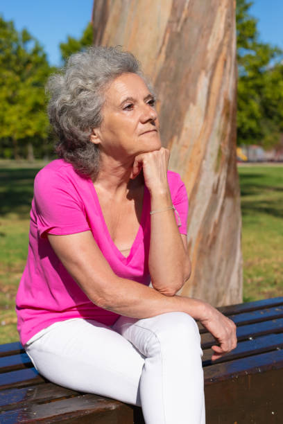 istock Pensive tired old lady waiting someone in park 1170658150