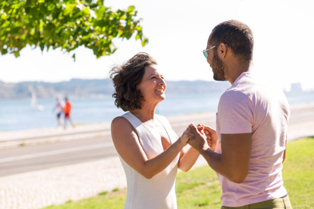 istock Cheerful couple meeting on promenade 1170658942