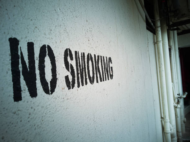 istock No Smoking written on the wall in an old building 1170660370