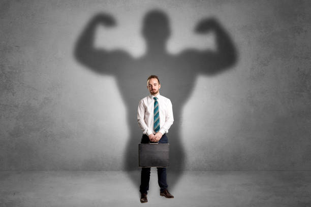istock Businessman with muscular shade behind his back 1170662651