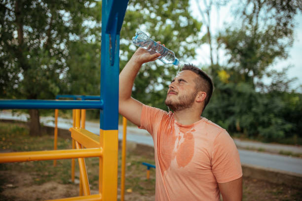 istock Overweight man exercising. The effort pays off! 1170664707