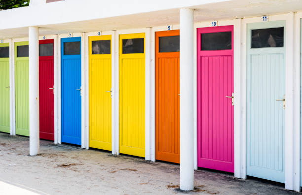 istock Row of changing cubicles with colorful doors on the beach. 1170666844