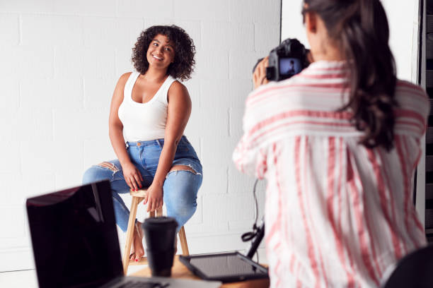 istock Model Posing For Female Photographer In Studio Portrait Session 1170669463