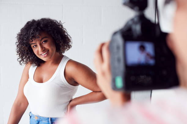 istock Model Posing For Female Photographer In Studio Portrait Session 1170669467