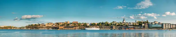 Photo of Stockholm, Sweden. Scenic Famous Panoramic View Of Embankment In Stockholm At Summer. Famous Popular Destination Scenic Place