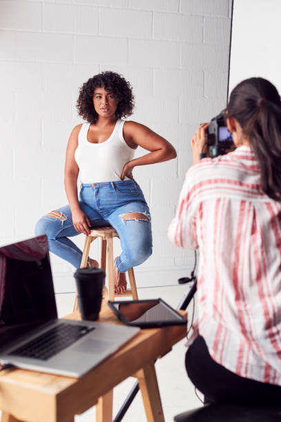 istock Model Posing For Female Photographer In Studio Portrait Session 1170669898