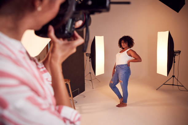 istock Model Posing For Female Photographer In Studio Portrait Session 1170672896
