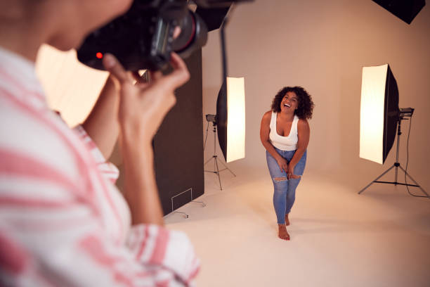 istock Model Posing For Female Photographer In Studio Portrait Session 1170673041