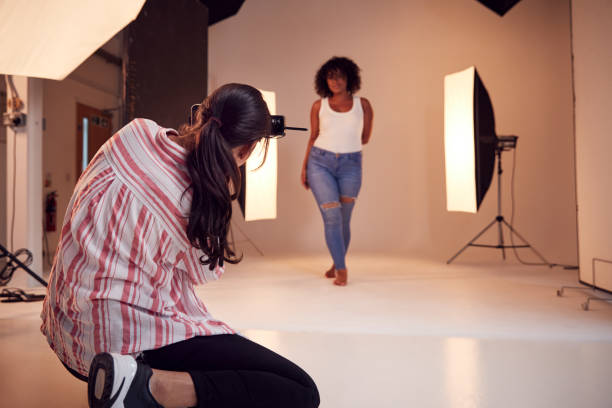 istock Model Posing For Female Photographer In Studio Portrait Session 1170673478