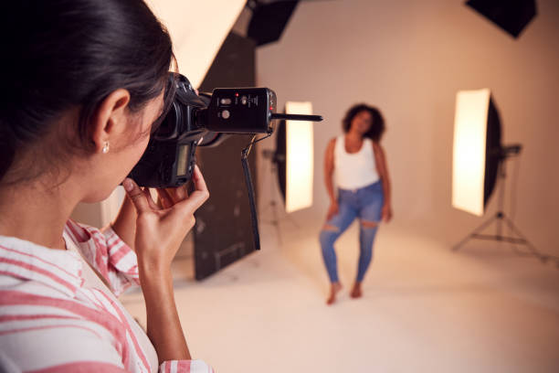 istock Model Posing For Female Photographer In Studio Portrait Session 1170673498