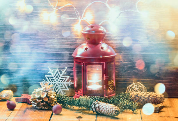 istock Christmas Lantern with decorations on wooden background 1170674356