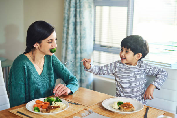 istock You have to eat your veggies too Mom! 1170675645