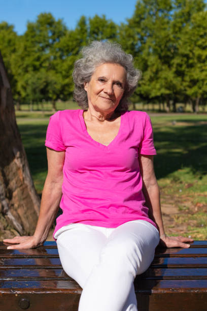 istock Happy confident old lady enjoying leisure time in park 1170675754