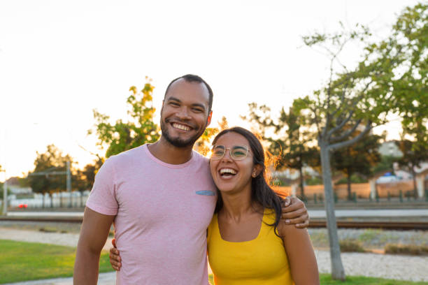 istock Joyful Latin couple posing in city park 1170677715