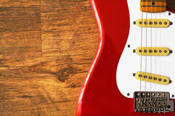 istock Electric guitar against textured wood as copy space 1170678278