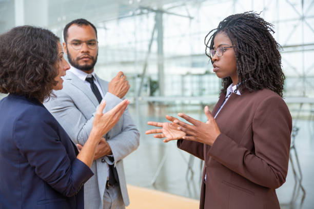 istock Professional multiethnic business team talking 1170678988
