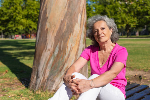 istock Serious pensive old lady thinking over issues in park 1170679230