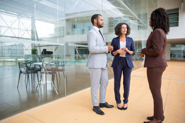 istock Serious multiracial business colleagues talking 1170680116