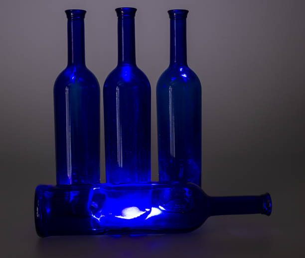 istock Blue wine bottles still life with colourful background 1170680214