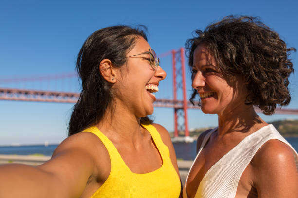 istock Joyful excited female friends enjoying walk 1170680292