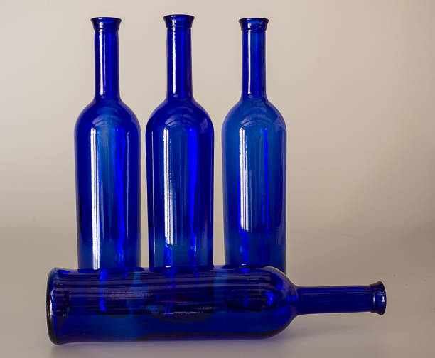 istock Blue wine bottles still life with colourful background 1170681052